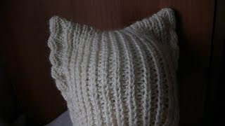 Вязание шапки с ушками на спицах.  Knitting hats with ears on the needles.