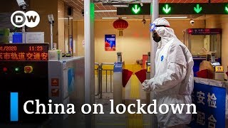 China puts millions under lockdown to contain Wuhan coronavirus | DW News