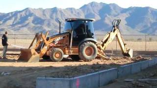CASE 580 Super M Series 2 Loader Backhoe Digging a Foundation