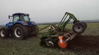Дисковая борона Amazone Catros 5м с железным катком DW  в паре с трактором Holland T7060