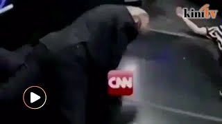 Trump tweets video of him wrestling against CNN