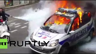 Police car smashed & set on fire during Paris protest