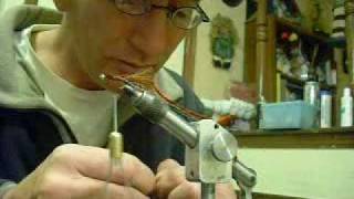 tying a brown woolly bugger