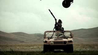 Soldiers attaching Humvee to Black Hawk helicopter.