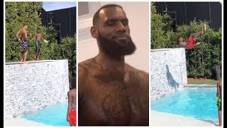 LeBron watches as his kids Bryce & Bronny have a jumping contest in their pool