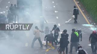 Tear gas, water cannon deployed as protesters defy gathering ban in Bangkok anti-govt march
