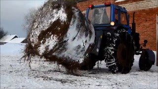 Размотчик сена в рулоне.