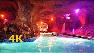 Lazy River Volcano Bay Tunnel POV Water Park Orlando Florida cavern cave pool lights