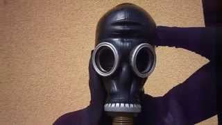Masking latex mask and russian gas mask over nylon encasement