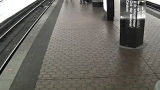 Raw: Man in Wheelchair Falls on Metro Tracks