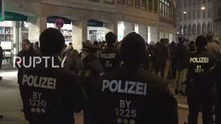 Germany: COVID vaccination sceptics hold candlelight vigil in Munich