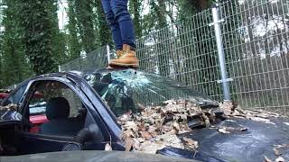 Timberland Boots walking on and denting cars at car scrapyard (stomp, trample and destroy)