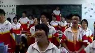 Students sing the Chinese National Anthem