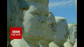 Giant presidents' statues crumble in field - BBC News