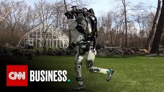 Humanoid robot runs through the park by itself