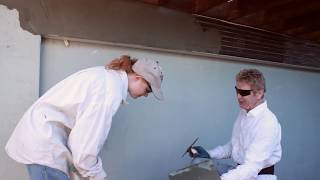 Installing new exterior plaster on a rebuilt deck and balcony
