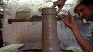 Throwing a big tall cylinder vase on a potters wheel demo pot throw