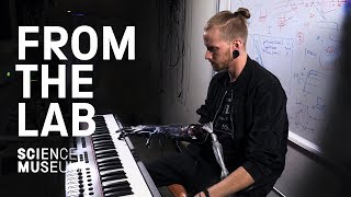 Musician plays the piano with a prosthetic hand
