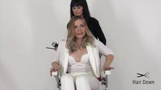 Blondie full barber treatment, head shaved smooth and eyebrows shaved.