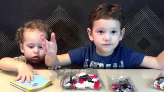 Марат открывает конструктор Лего из серии Lego Creator