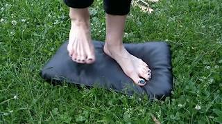 Faux leather pillow trampling by girl with black polish