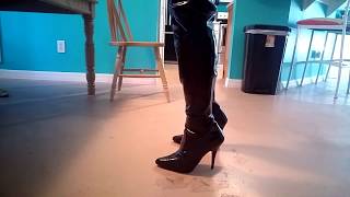 Putting on squeaky Pleaser thigh high boots with white tights.