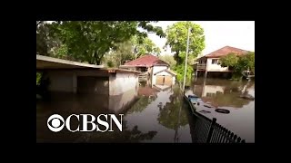 Powerful storm brings flooding to eastern Australia but eases bushfires