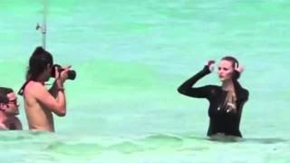 Topless Lara Stone sizzles at the poolside in Miami as she shows off her model body