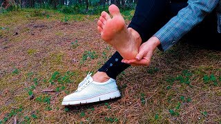 Hot girl puts on her shoes on bare feet