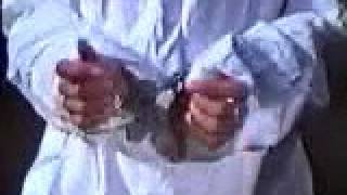 Female prisoner handcuffed and shackled