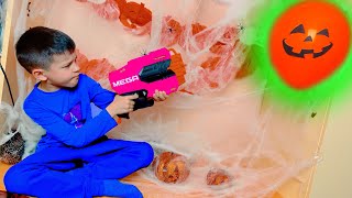 Den with Nerf vs Halloween balloons