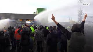Police deploy water cannons at anti-Green Pass protest at Trieste port in Italy