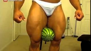 Romanian bodybuilder flexes and crushes a watermelon with his legs