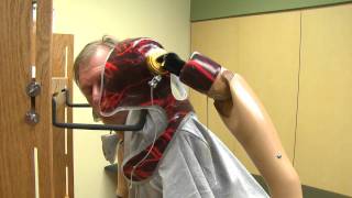 Bilateral Arm Amputee Puts on Prosthesis - Uses Dressing Tree