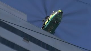 Helicopters rescue residents from burning building