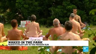 Paris: Naked in a park, Parisian nudists enjoy a hot day in the sun