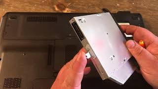 How to remove and install a DVD drive on a HP Pavilion DV7 laptop
