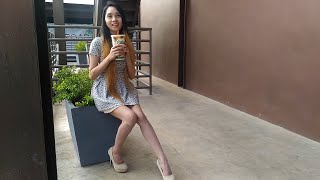 Cute and sexy asian girl walking on grey platform high heels