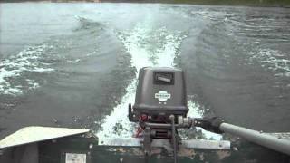 9.8hp Nissan outboard running at the lake