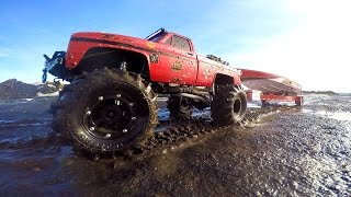 RC ADVENTURES - Mega Mud Truck Blows Motor pulling Speed Boat