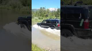 Jeep Commander fording the river (Colorado)