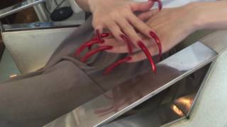 A new video by our model Mood Zhang with her red very long nails (video 2)