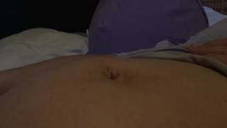 Pregnant woman with umbilical hernia shows off belly button trick