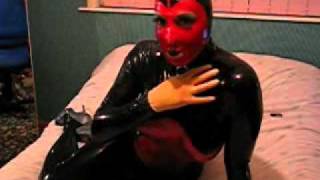 Rubber doll on bed