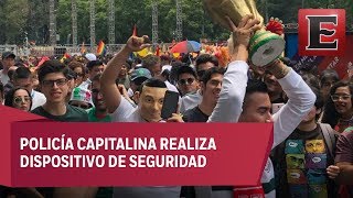 Asistentes de la marcha gay y aficionados del Tricolor comparten festejo en el Ángel