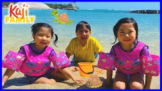 Family Fun at the Beach in Hawaii and playing in the sand!