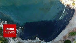 Oil spill turns Greek island bay black - BBC News
