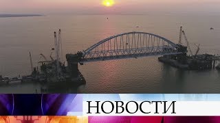 Железнодорожную арку Керченского моста поднимают на фарватерные опоры.