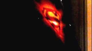 Airbrushing Superman logo on a black t-shirt