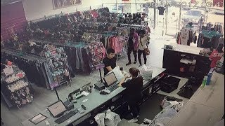 Shoplifters caught on camera stealing clothes from two resale shops